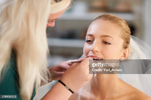 lipstick is always last - bridal makeup stockfoto's en -beelden