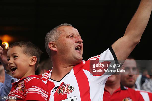 Sunderland fans cheer during the Barclays Premier League match between Crystal Palace and Sunderland at Selhurst Park on August 31, 2013 in London,...