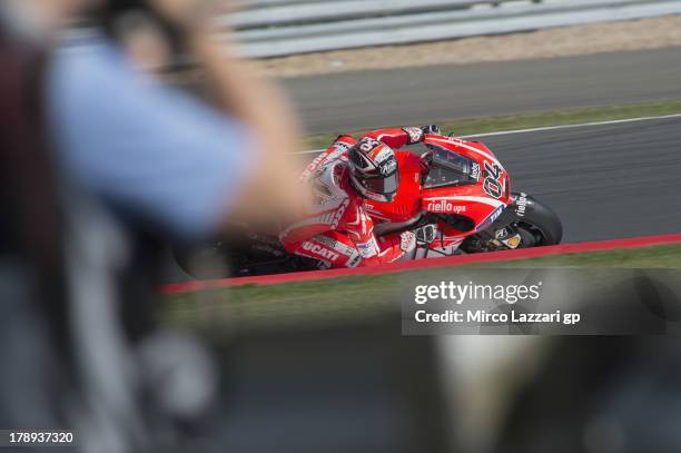 Andrea Dovizioso of Italy and Ducati Marlboro Team round sthe bend during the MotoGp Of Great Britain - Qualifying at Silverstone Circuit on August...