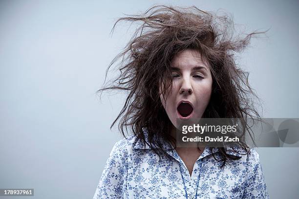 young woman yawning, close up - hairstyle stock-fotos und bilder