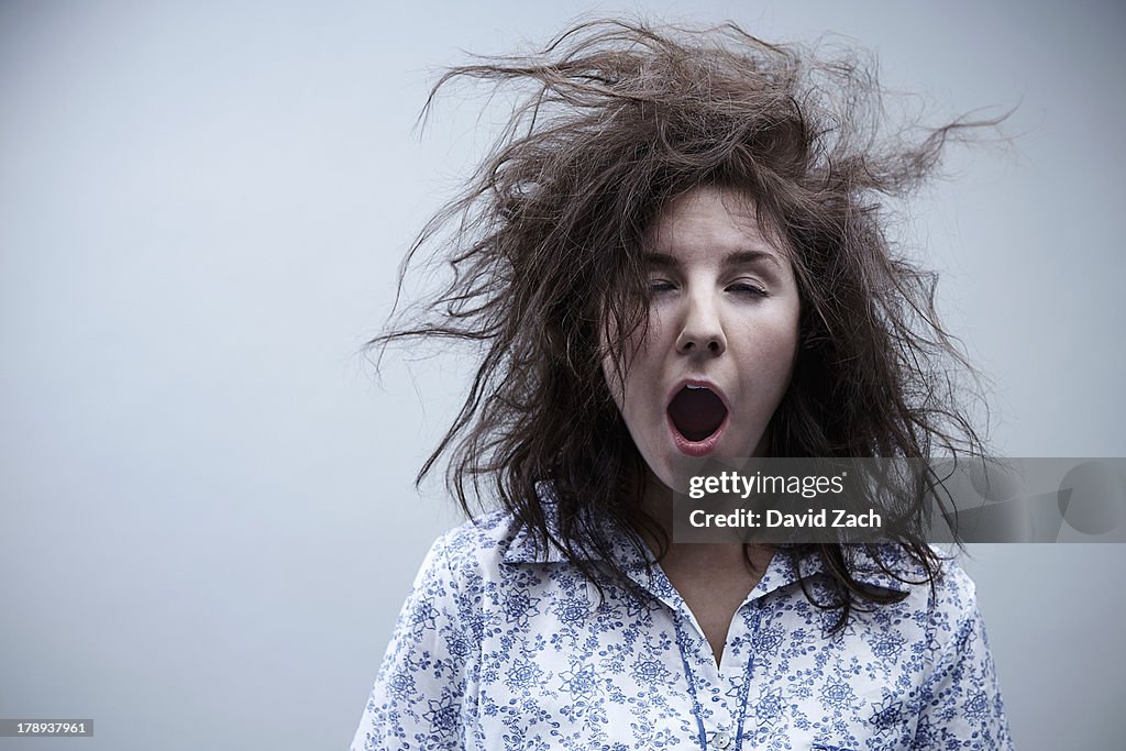 Young woman yawning, close up