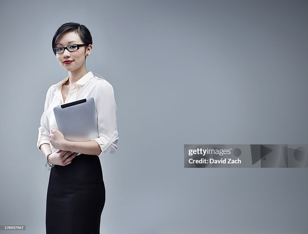 Chinese businesswoman holding digital tablet