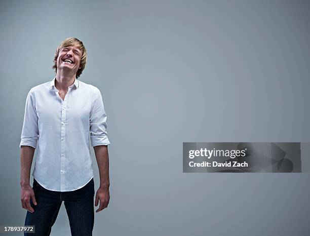 young man laughing, portrait - man white studio shot collared shirt stock pictures, royalty-free photos & images