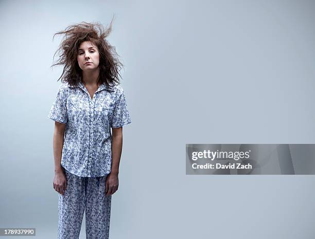 young woman in pajamas, portrait - strubbelhaar stock-fotos und bilder