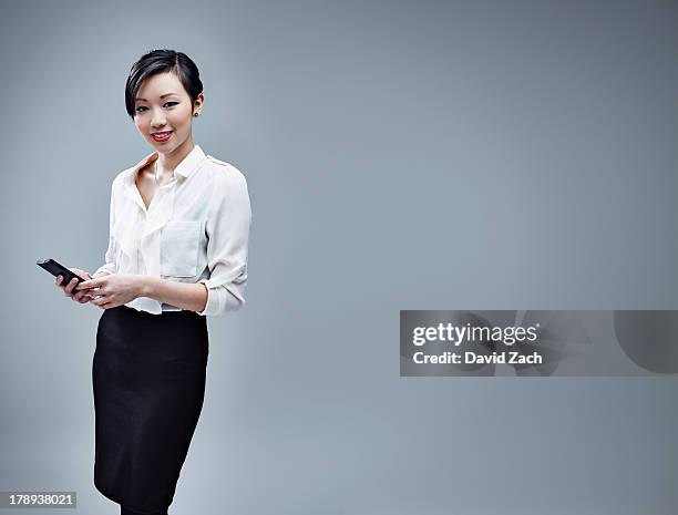 chinese business woman using mobile phone, portrai - pencil skirt beautiful stock pictures, royalty-free photos & images