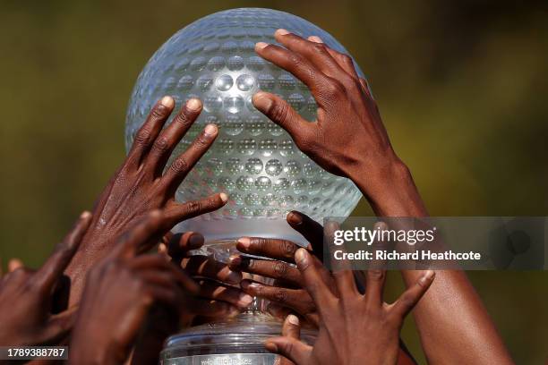 Max Homa of the United States is surrounded by a crowd of ground staff as he holds the trophy after winning the tournament during Day Four of the...