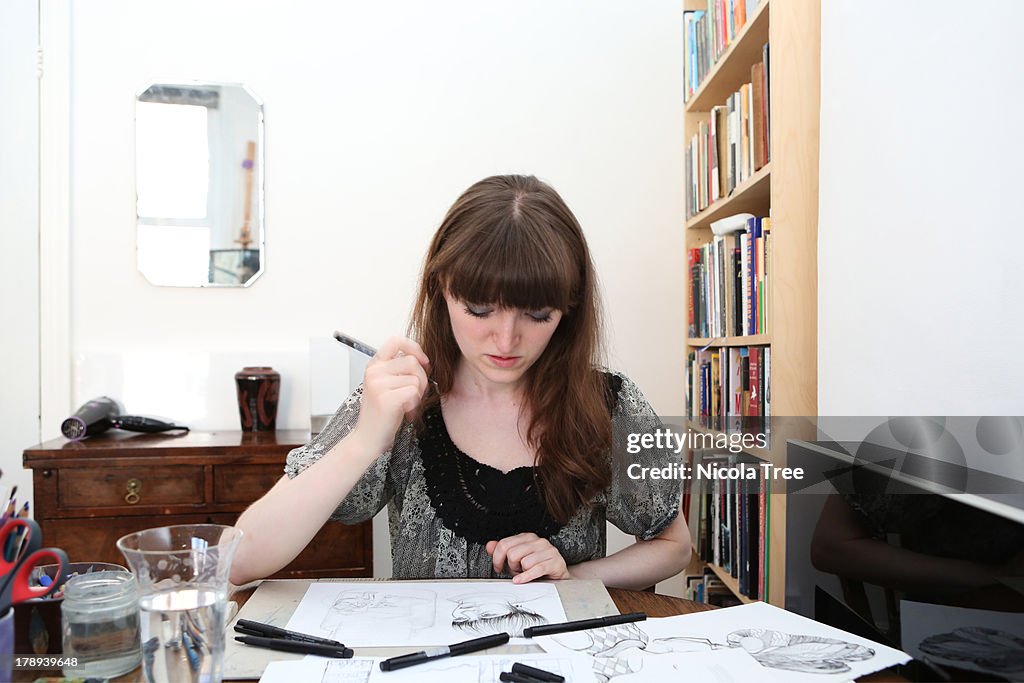 An illustrator working at home on illustrations