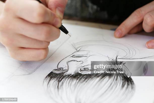 an illustrator working on a drawing - human representation stock pictures, royalty-free photos & images