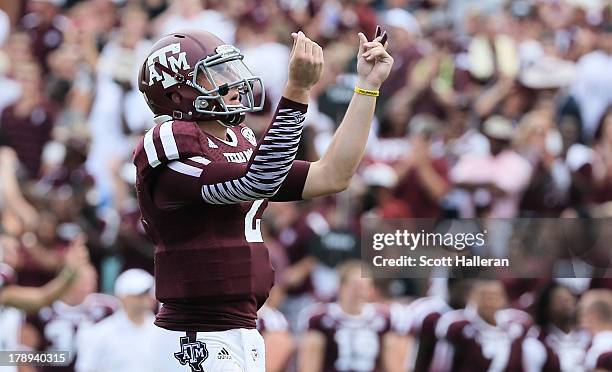 Johnny Manziel of the Texas A&M Aggies celebrates a third quarter touchdown during the game against the Rice Owls at Kyle Field on August 31, 2013 in...