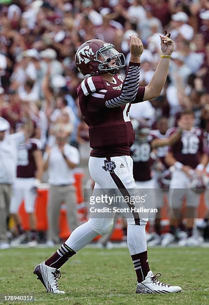 Johnny Manziel of the Texas A&M Aggies celebrates a third quarter touchdown during the game against the Rice Owls at Kyle Field on August 31, 2013 in...