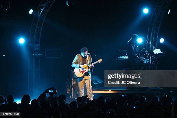 Musicians Enrique Rangel and Emmanuel Del Real of Cafe Tacvba perform on stage at the Nokia Theatre inside L.A. Live on August 30, 2013 in Los...