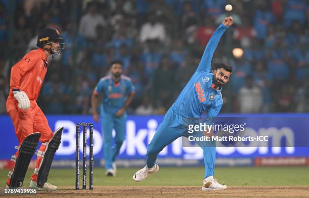 Virat Kohli of India in bowling action during the ICC Men's Cricket World Cup India 2023 between India and Netherlands at M. Chinnaswamy Stadium on...