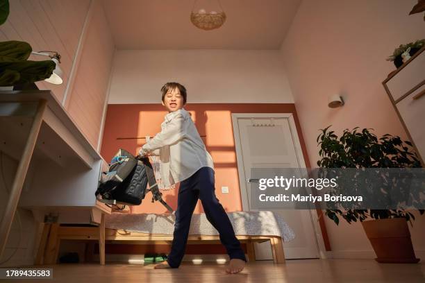 the boy swings his backpack to throw it. the end of the school year, finally the holidays. - academic year stock pictures, royalty-free photos & images