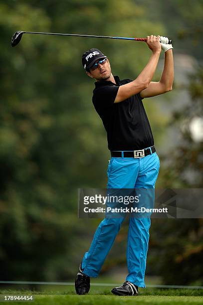 Scott Harrington hits his tee shot on the sixth hole during round three of the 2013 Hotel Fitness Championship at Sycamore Hills Golf Club on August...