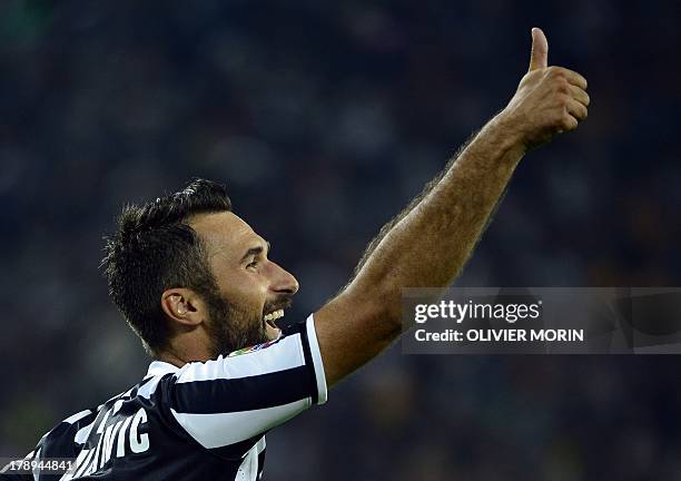 Juventus' forward Mirko Vucinic of Montenegro celebrates after scoring during the Italian league seria A match between Juventus and Lazio on August...