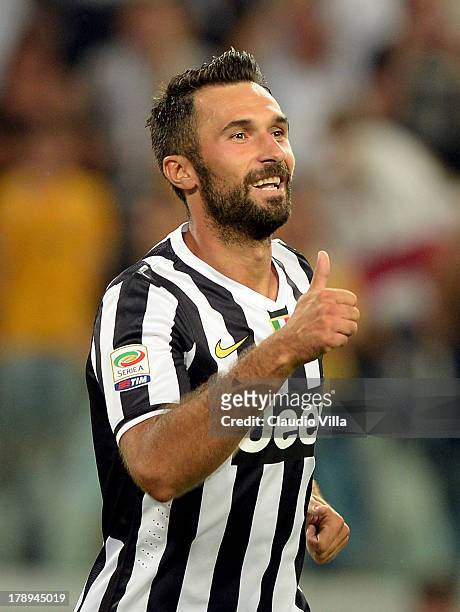 Mirko Vucinic of FC Juventus celebrates scoring the third goal during the Serie A match between Juventus and SS Lazio at Juventus Arena on August 31,...