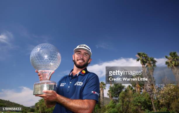 Max Homa of the United States poses with the trophy as he celebrates victory after winning the tournament during the final round of the Nedbank Golf...