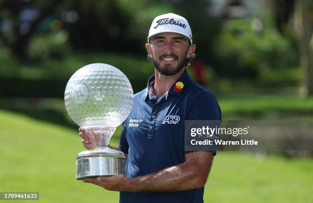 Max Homa of the United States poses with the trophy as he celebrates victory after winning the tournament during the final round of the Nedbank Golf...