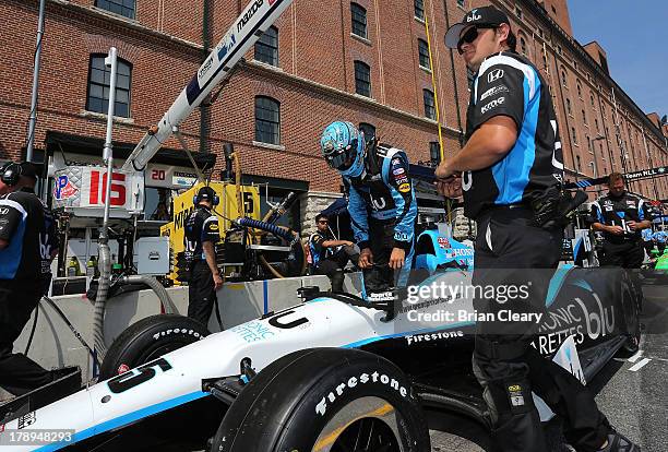 Graham Rahal, driver of the Rahal Letterman Lanigan Racing Honda Dallara prepares for practice for the Grand Prix of Baltimore on August 31, 2013 in...