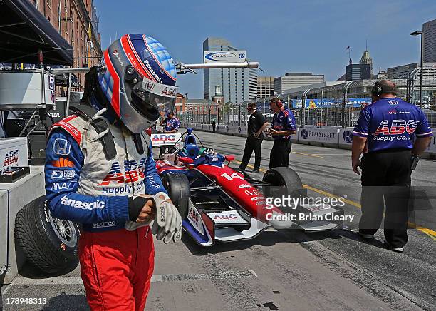 Takuma Sato, of Japan, driver of the A.J. Foyt Enterprises Honda Dallara prepares for practice for the Grand Prix of Baltimore on August 31, 2013 in...