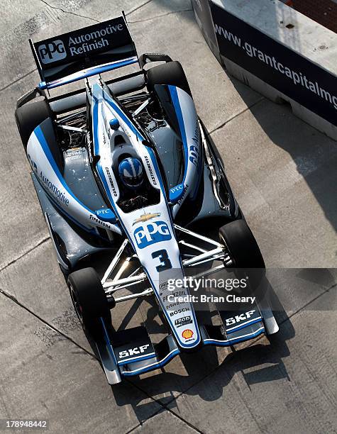 Helio Castroneves, of Brazil, driver of the Team Penske Chevrolet Dallara drives through a turn during for practice for the Grand Prix of Baltimore...