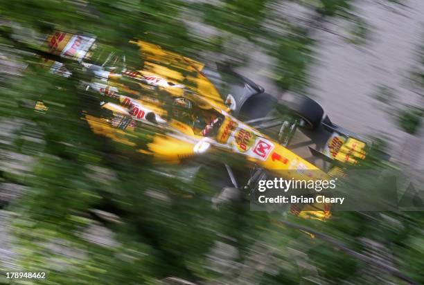 Ryan Hunter-Reay, driver of the Andretti Autosport Chevrolet Dallara drives past some trees during practice for the Grand Prix of Baltimore on August...