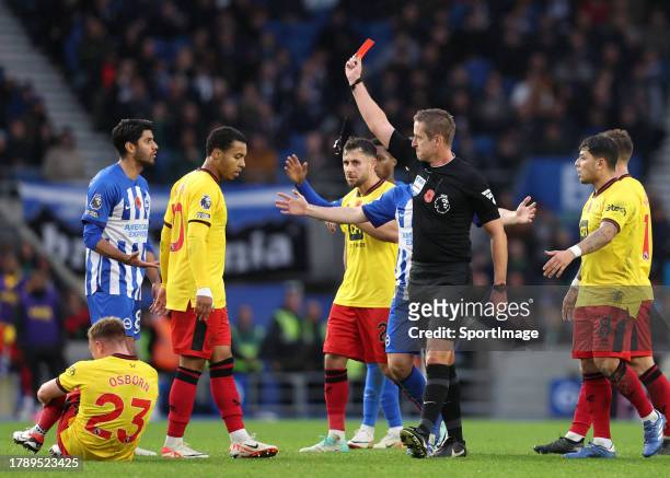 Referee John Brookes sends off Mahmoud Dahoud of Brighton for a tackle on Ben Osborn of Sheffield United during the Premier League match between...