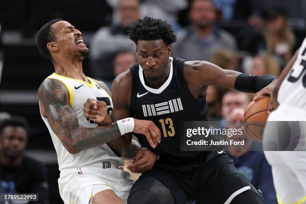 Jaren Jackson Jr. #13 of the Memphis Grizzlies handles the ball against John Collins of the Utah Jazz during the game at FedExForum on November 10,...