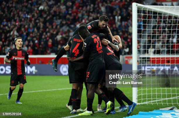 Odilon Kossounou of Bayer Leverkusen celebrates with teammates after scoring the team's second goal during the Bundesliga match between Bayer 04...