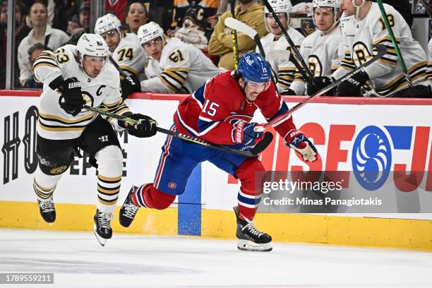 Alex Newhook of the Montreal Canadiens skates ahead of Brad Marchand of the Boston Bruins during the second period at the Bell Centre on November 11,...