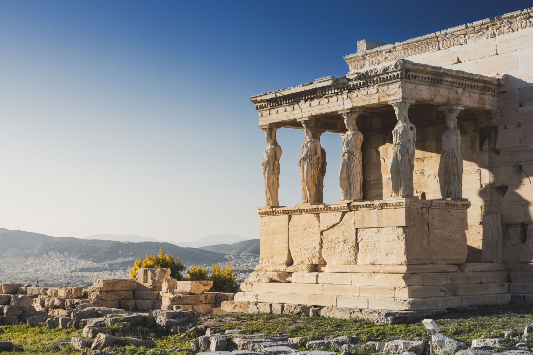 Cariatides Porch, Erechtheion on Acropolis of Athens against blue sky. Cariatides Porch, Erechtheion on Acropolis of Athens against blue sky.