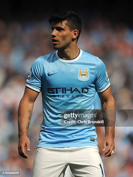 Sergio Aguero of Manchester City looks on during the Barclays Premier League match between Manchester City and Hull City at the Etihad Stadium on...