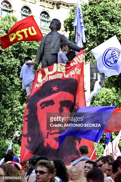 Students gather under a banner with the image of Argentinian Che Guevara who was the Cuban Revolution leader, to protest in a square of Rio de...