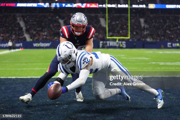 Hunter Henry of the New England Patriots misses a catch in the endzone as Julian Blackmon of the Indianapolis Colts applies pressure in the fourth...