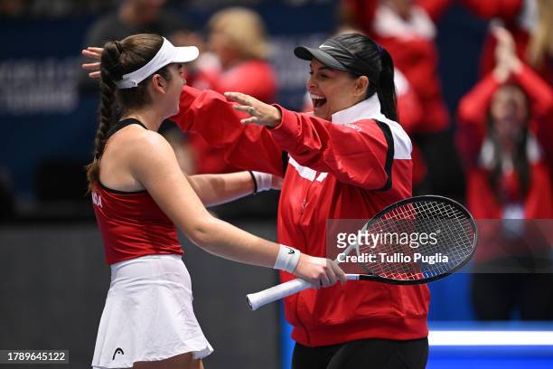 Marina Stakusic of Team Canada celebtares with Captain Heidi El Tabakh after winning her match against Martina Trevisan during the Billie Jean King...