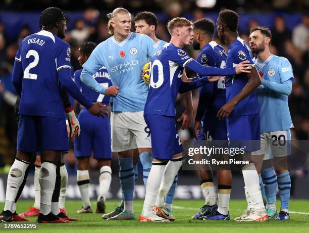 Chelsea players react towards Manchester City players as Erling Haaland of Manchester City is awarded a penalty during the Premier League match...