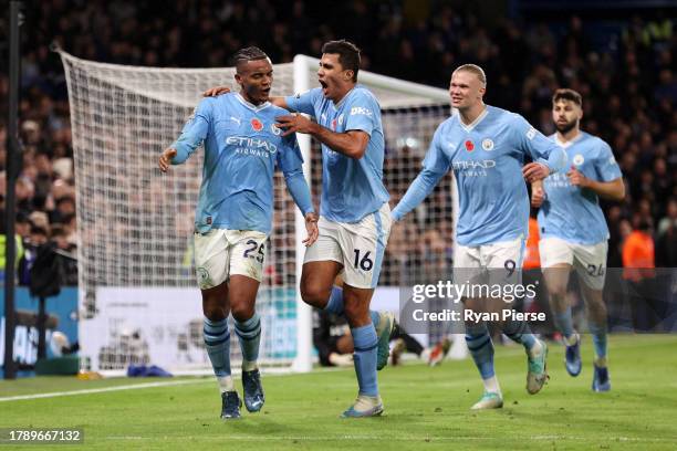 Manuel Akanji of Manchester City celebrates with teammate Rodri after scoring the team's second goal during the Premier League match between Chelsea...