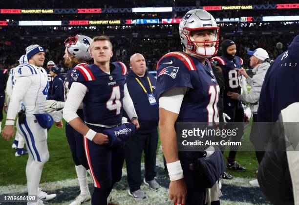 Bailey Zappe of the New England Patriots and Mac Jones of the New England Patriots look dejected following the team's 10-6 defeat during the NFL...