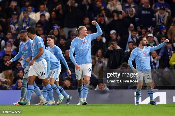 Erling Haaland of Manchester City celebrates after scoring the team's third goal during the Premier League match between Chelsea FC and Manchester...