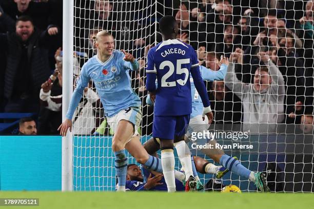 Erling Haaland of Manchester City celebrates after scoring the team's third goal during the Premier League match between Chelsea FC and Manchester...