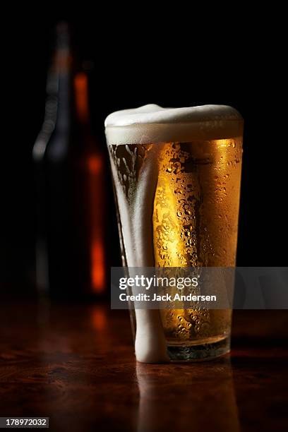 bar beer - overflowing beer stock pictures, royalty-free photos & images