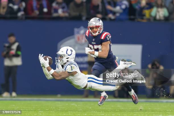 Josh Downs of Indianapolis Colts controls the ball during the NFL match between Indianapolis Colts and New England Patriots at Deutsche Bank Park on...