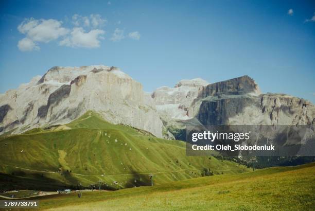 rolling landscape of dolomites mountains - trento stock pictures, royalty-free photos & images
