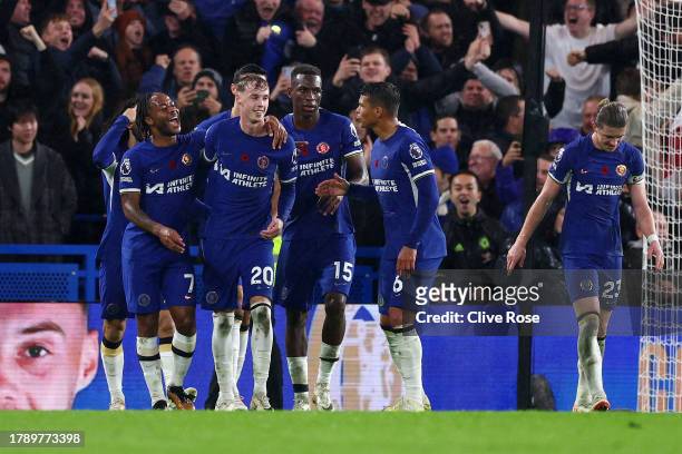 Cole Palmer of Chelsea celebrates with teammates after scoring the team's fourth goal from a penalty during the Premier League match between Chelsea...