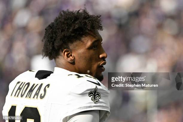 Michael Thomas of the New Orleans Saints on the bench before the game against the Minnesota Vikings at U.S. Bank Stadium on November 12, 2023 in...