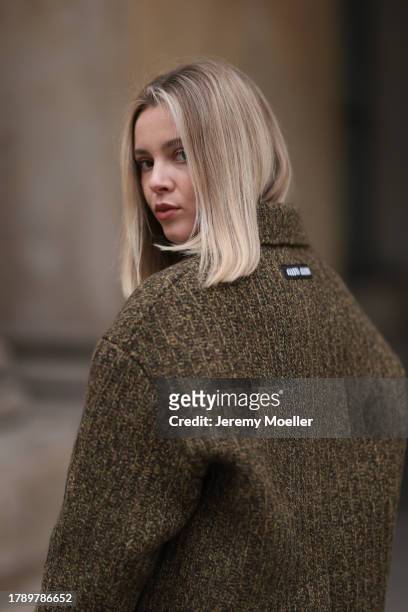 Isabelle Hartmann seen wearing Miu Miu khaki green knit wool short logo jacket, on November 12, 2023 in Hamburg, Germany.