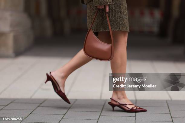 Isabelle Hartmann seen wearing Miu Miu khaki green knit wool short jacket, matching Miu Miu khaki green knit wool short skirt, The Row brown leather...