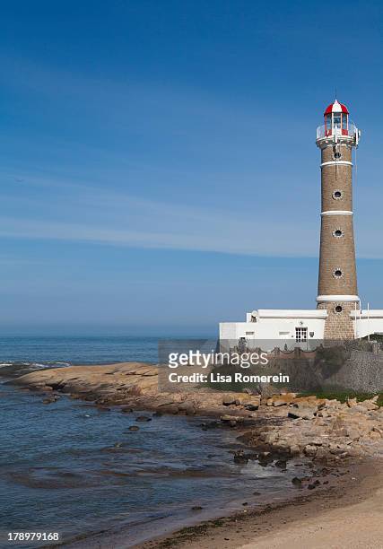 lighthouse on the ocean - jose ignacio lighthouse stock pictures, royalty-free photos & images