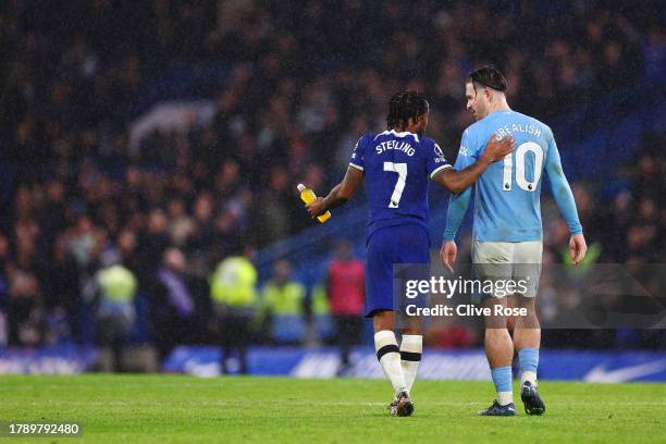 Raheem Sterling of Chelsea interacts with Jack Grealish of Manchester City following the Premier League match between Chelsea FC and Manchester City...