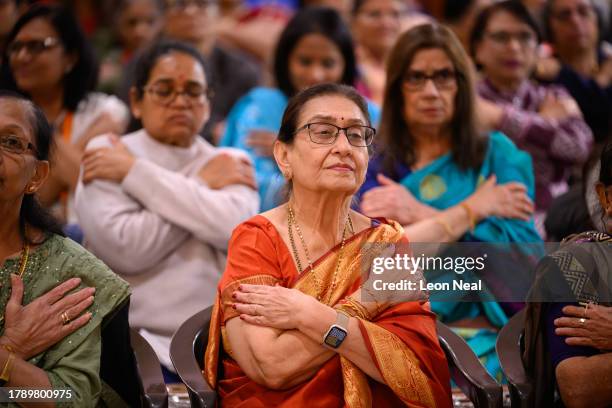 Devotees and well-wishers observe the ritual of Sharda Pujan during Diwali celebrations at Neasden Temple, also known as BAPS Shri Swaminarayan...